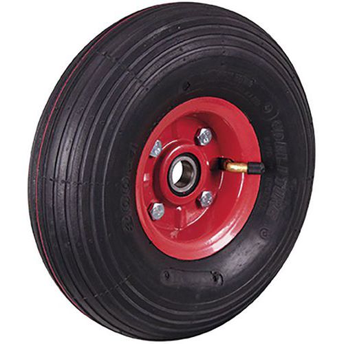 Roue pneumatique avec des rainures dans la bande de roulement